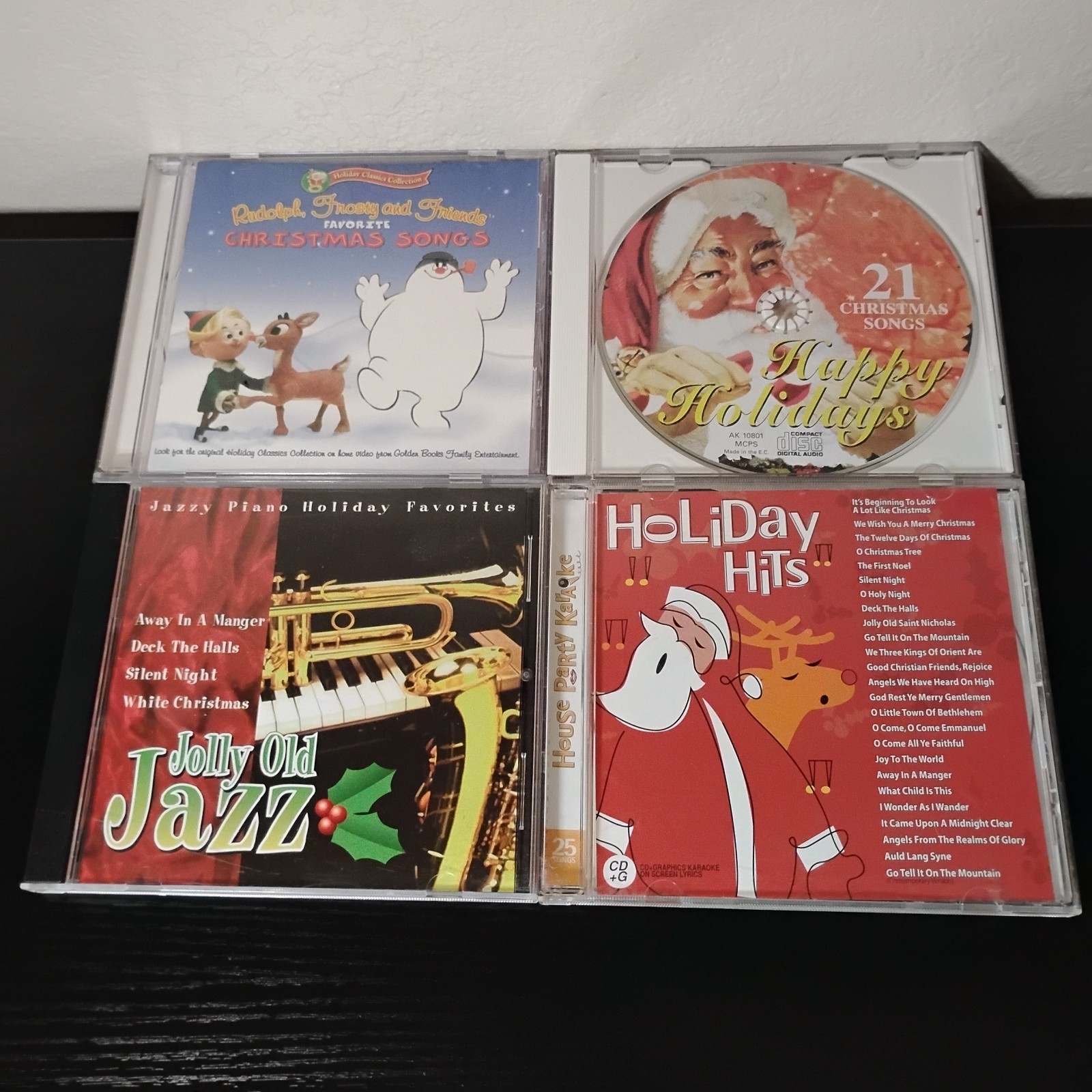 Lot of 4 Christmas Holiday Music CDs Rudolph Frosty Happy Holidays Jazz Karaoke