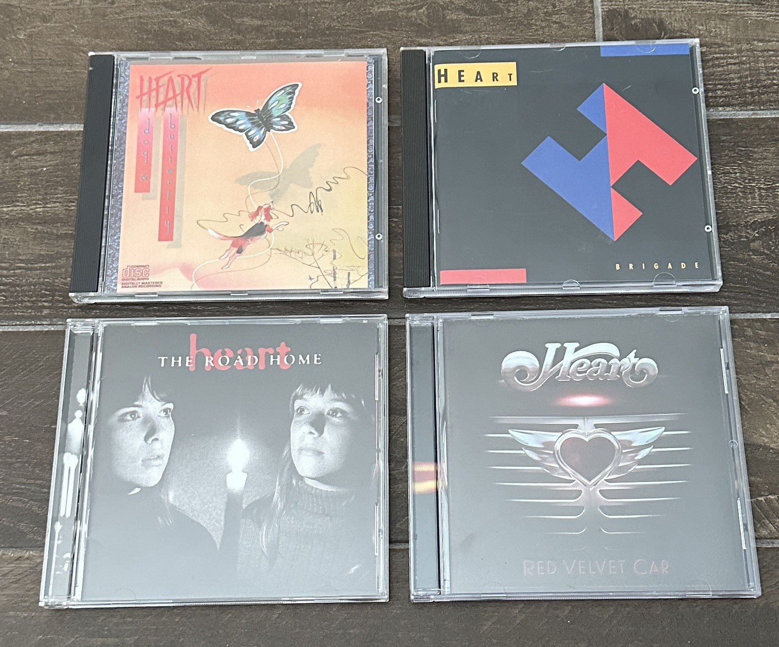 SET OF 4 HEART CDS – Dog & Butterfly, Brigade, The Road Home, Red Velvet Car